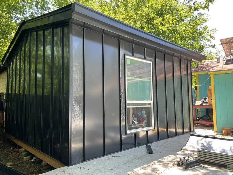 Black standing seam metal wall panels for Roof Inspection in Olympia Heights