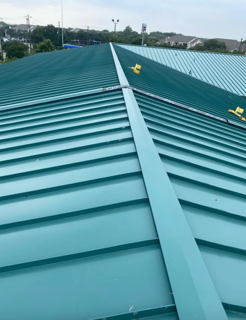 Green commercial metal roof ridge and valley for Metal Roof Repair in Olympia Heights