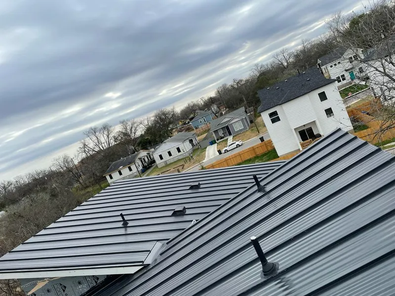Standing seam metal roof panels with vents for Skylight Repair in Olympia Heights